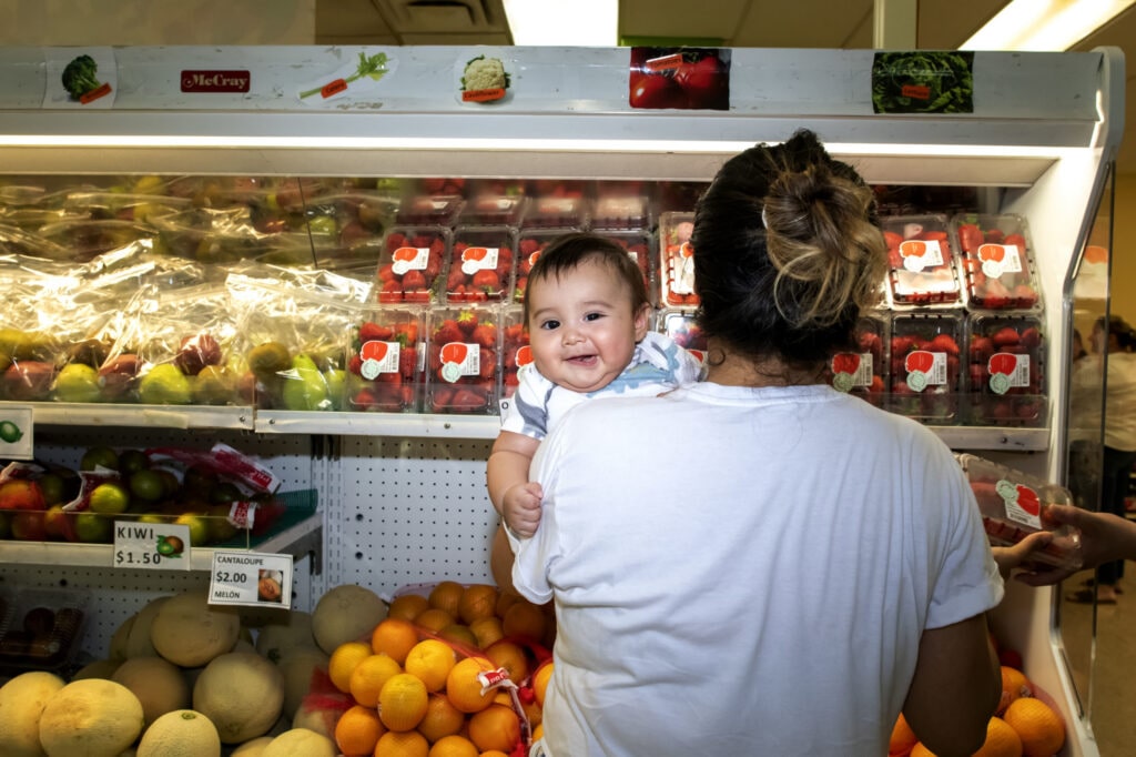 Mother shopping at Food Pantry with her child