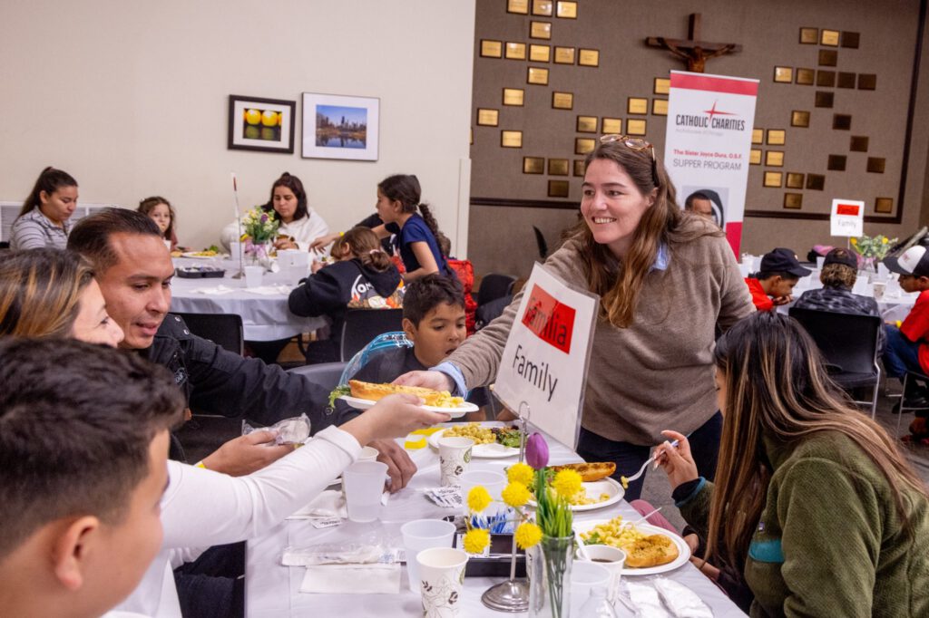 Volunteer Serving food at dinner