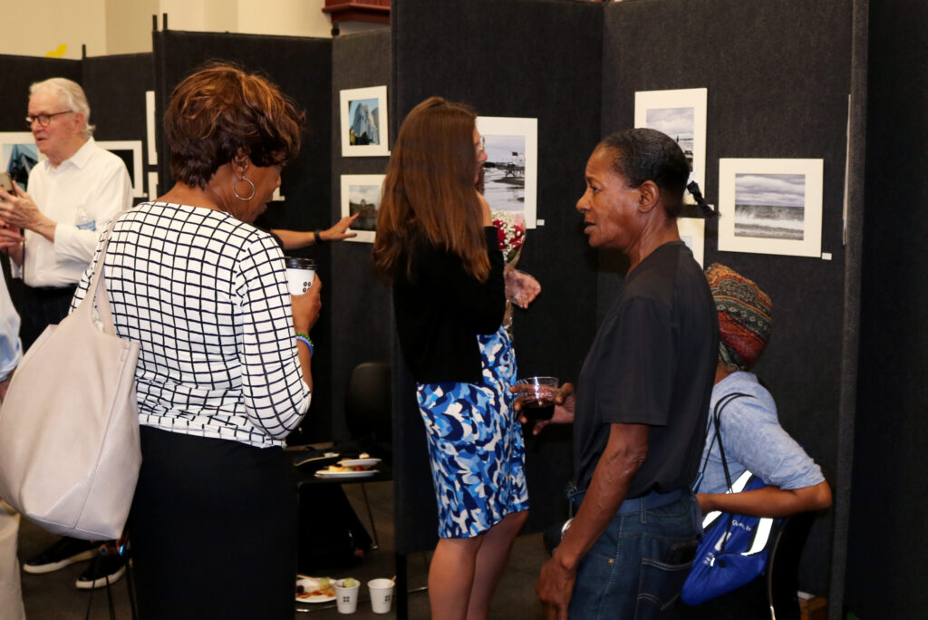 Guests observing art