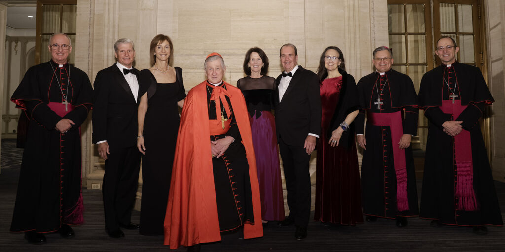 People posing with Cardinal Blase Cupich, Arch Bishop of Chicago at the St. Nicholas Ball 2024