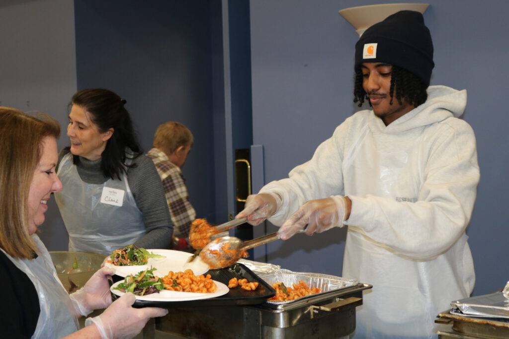 Volunteer serving food