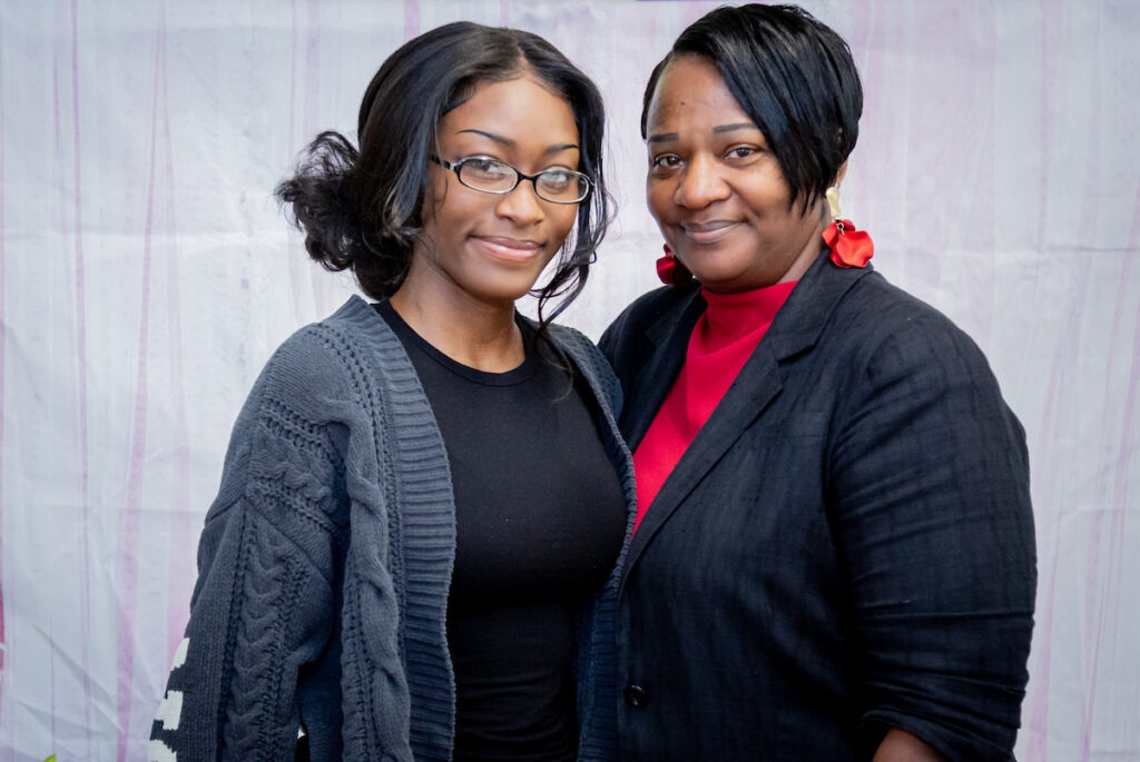Graduates who have successfully completed the five-year Catholic Charities Family Self-Sufficiency Program celebrate with their families and program leaders at the Schreiber Center in Round Lake, Illinois