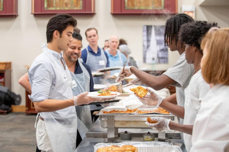 Volunteers serve at community meals in Cook and Lake counties.