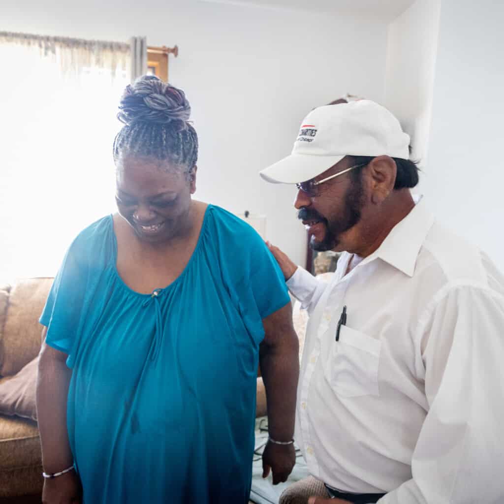Driver Ramiro Gonzalez Avila delivers meals on wheels to Erma Graham