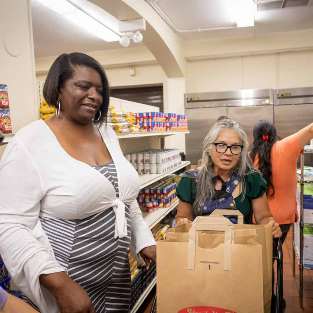 Two women at shopping together at food pantry