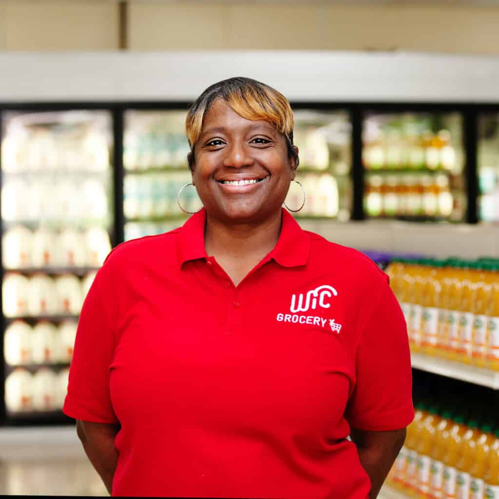 Woman smiling at WIC grocery store