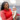 Doula Keiona Johnson Smiling holding a newborn baby