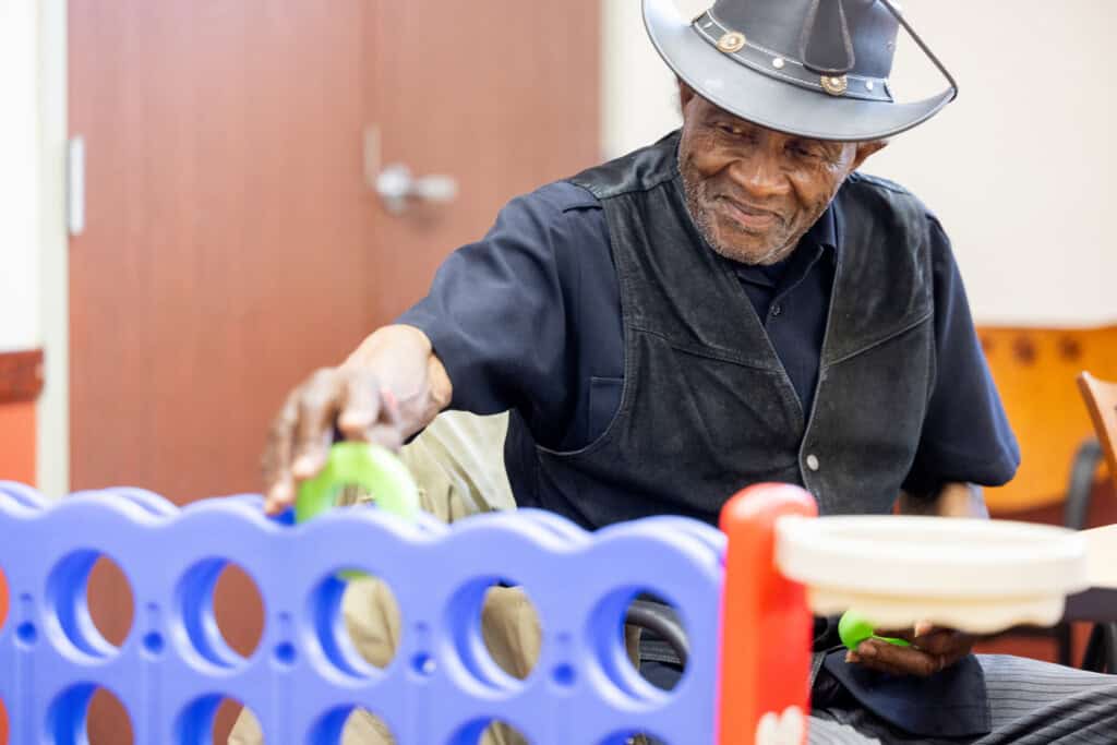 Senior socializing and playing connect 4