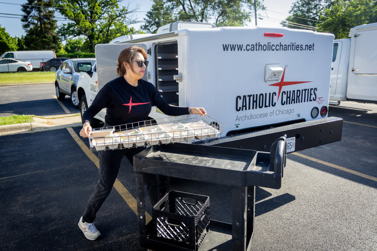 Meals on Wheels - Volunteer loading food onto truck