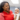 Doula Keiona Johnson holds a baby.