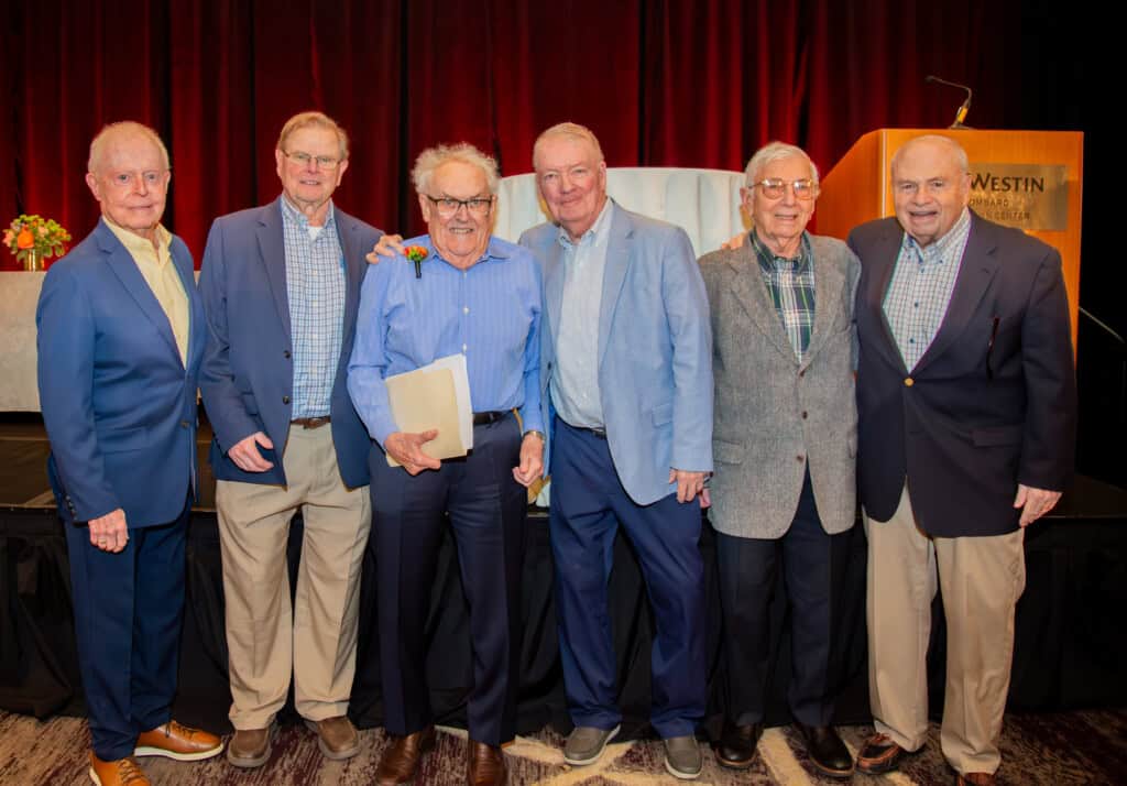 Father Rubey and senior gentlemen at Blossoms of Hope Brunch 2026