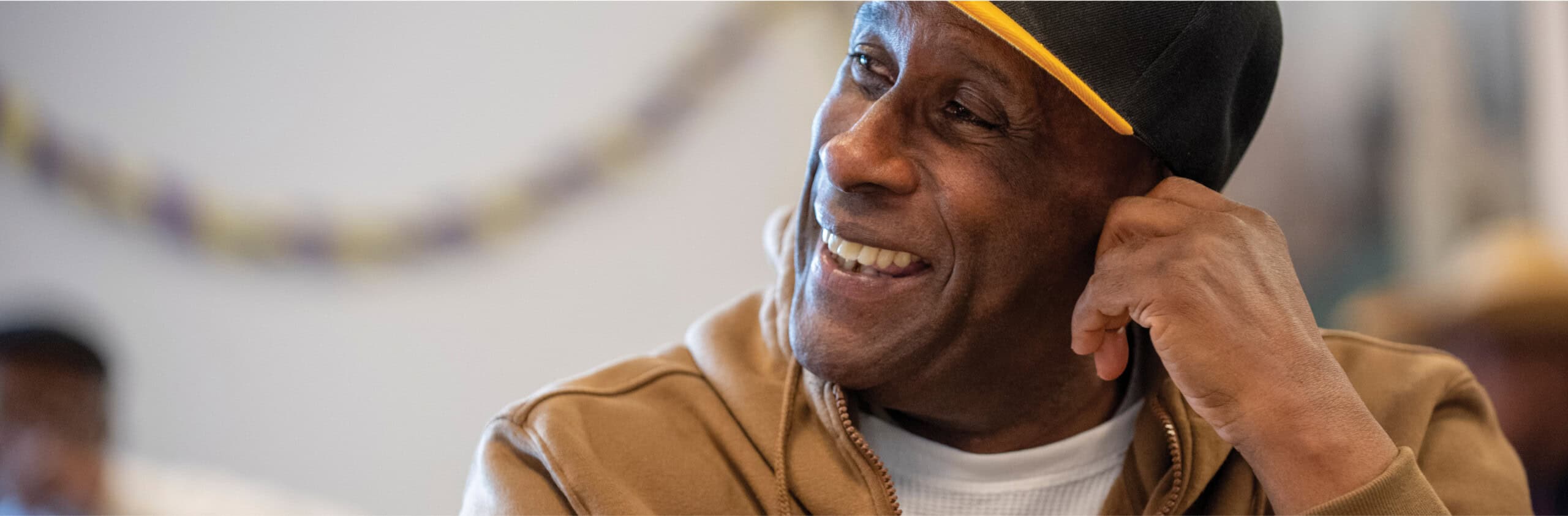 Man smiling looking off into the distance