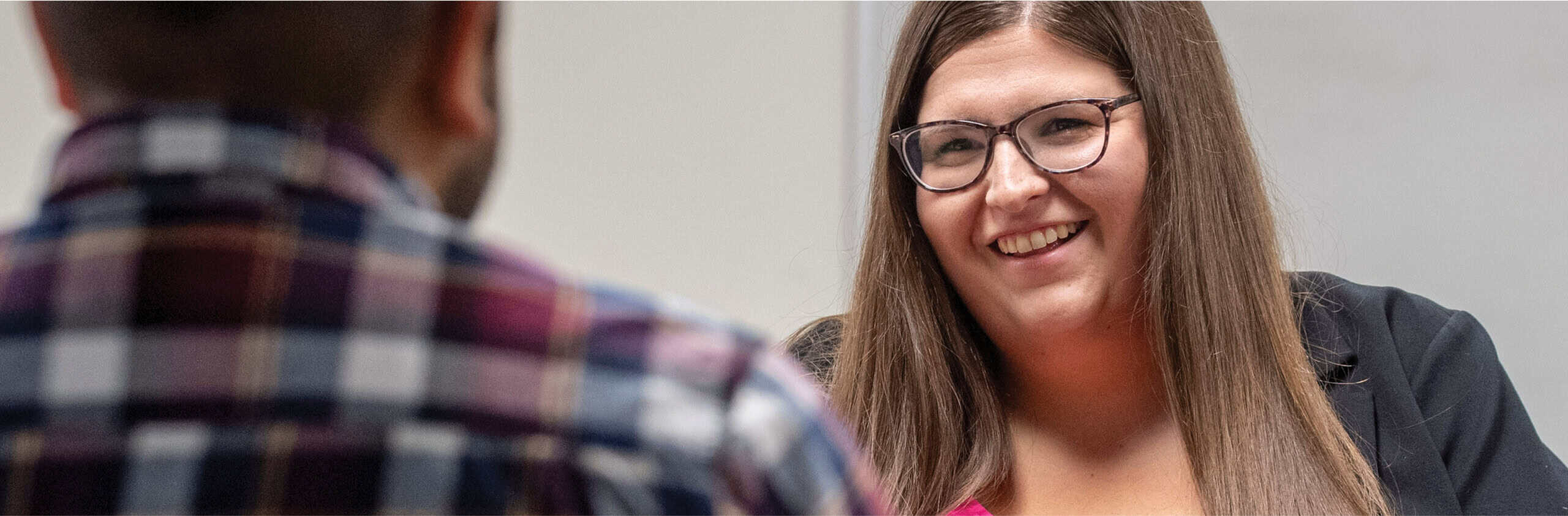 Therapist Nicolle Gaudette speaking with a man