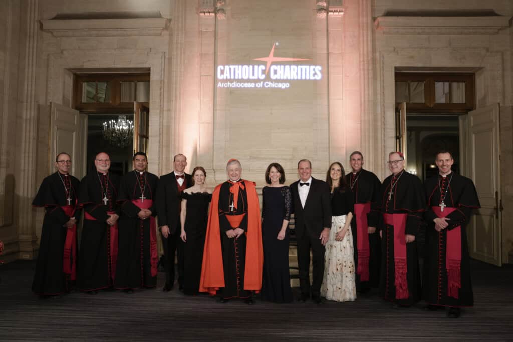Cardinal Blase Cupich, Arch Bishop of Chicago and Catholic Charities Employees smiling at Saint Nicolas Ball 2025