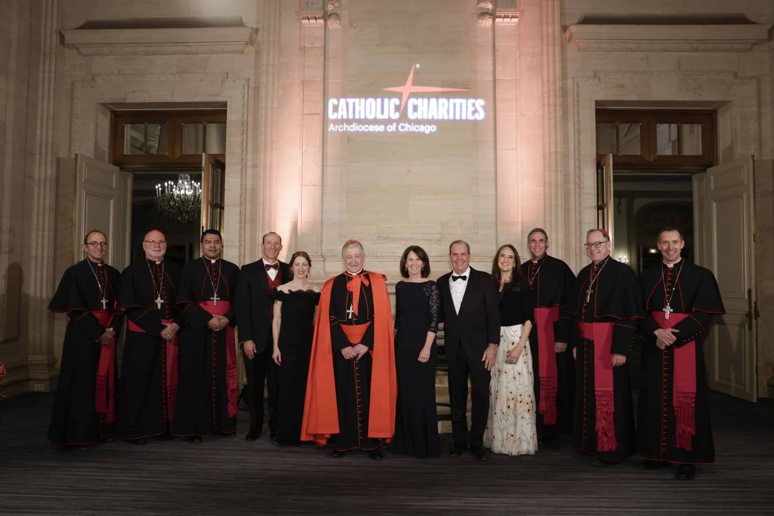 Cardinal Blase Cupich, Arch Bishop of Chicago and Catholic Charities Employees smiling at Saint Nicolas Ball 2025