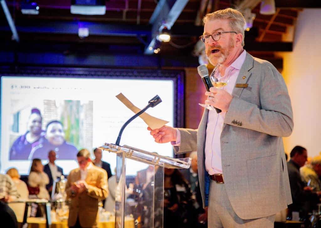 Man giving a speech at 2026 D'Vine Affair