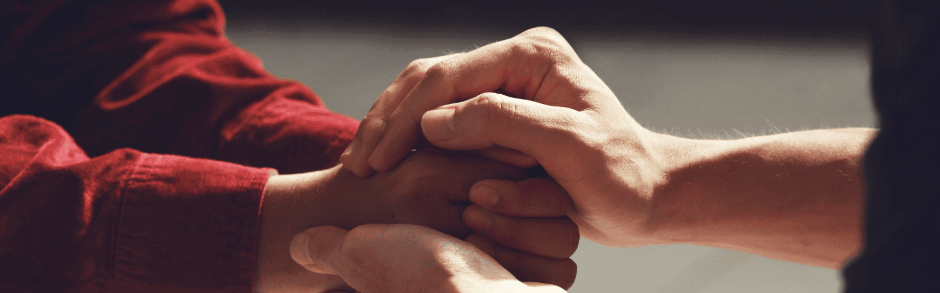 Hands being embraced