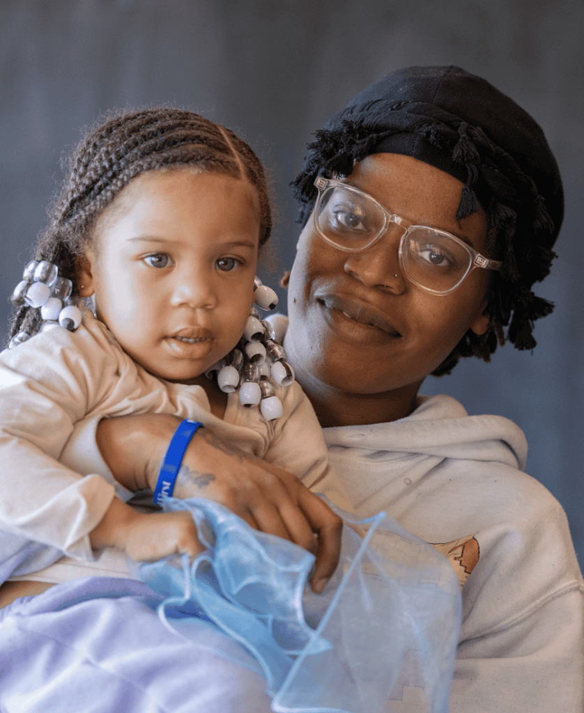 Woman holding her child closeup shot